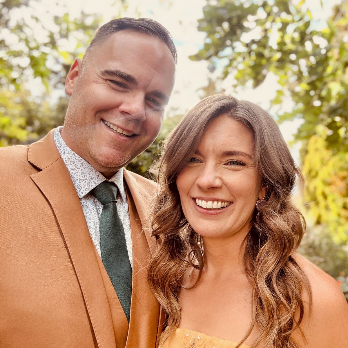 Nate and Brittany, Junipy's founders, smiling outdoors